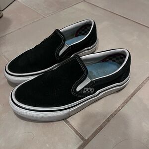 Vans Black and White Slip-On Sneakers